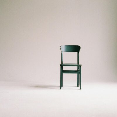 wooden chair on a white wall studio