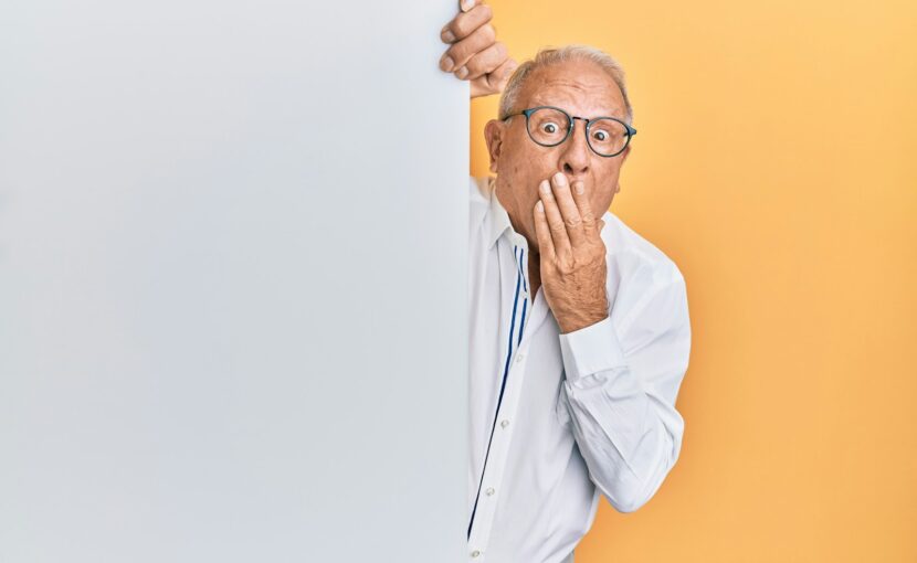 man in white dress shirt wearing black framed eyeglasses
