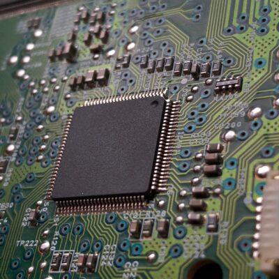close-up photography of green motherboard